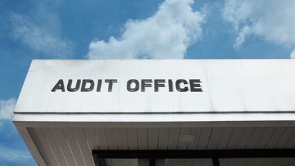 Audit Office word sign displayed on building under clear blue sky, representing financial oversight, accounting, inspection, and professional services