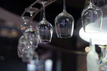 Close-up of hanging wine glasses in a bar