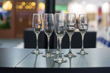 Empty champagne glasses arranged on the bar