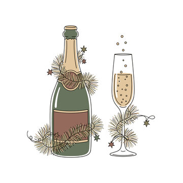 Sparkling wine bottle and glass decorated with festive greenery  
