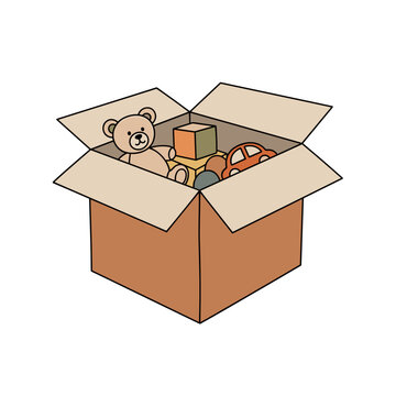 Cardboard box filled with toys including a teddy bear and blocks  