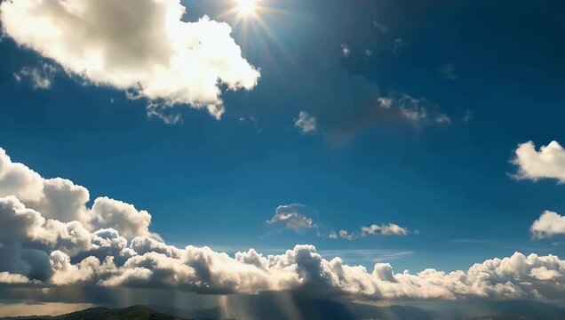 Beautiful 4K Ultra HD time lapse video 30x speed capturing white clouds forming and subsequently burning off in the bright sunlight against a clear blue sky with some areas of heavy grey cloud