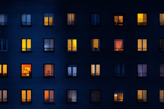 Warm light spills from windows, hinting at unique stories within