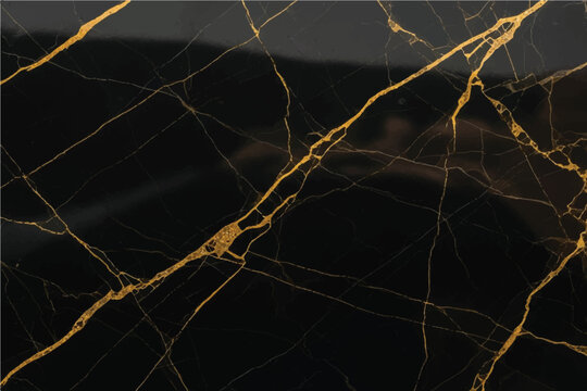 Luxurious black marble surface with striking veins of metallic gold evoking elegance and sophistication for high end interior design applications