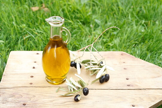 Olive oil on a wooden board