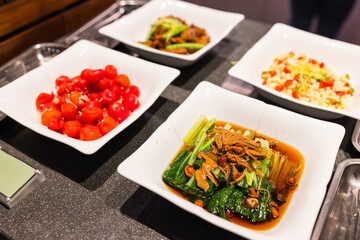 Taiwanese small dishes pickled tomato mushroom spinach buffet