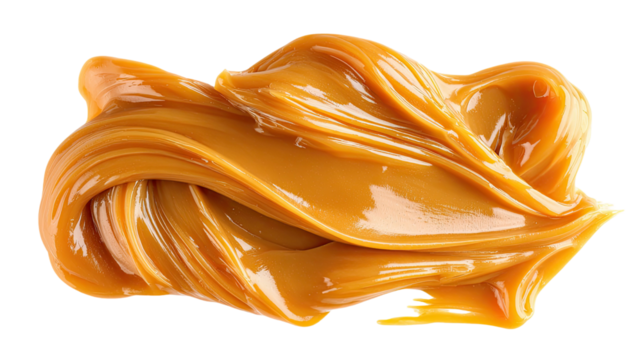 Smears of condensed milk and rich caramel paste spread in smooth glossy textures creating a closeup food detail on white background