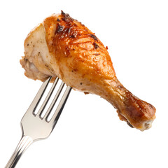 Juicy roasted chicken leg on a fork close up