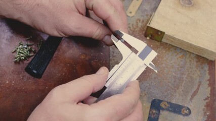 Caliper measuring screw head Old tools grungy background Vintage woodworking tools rusty table old hand drill metal chuck handle, a vernier caliper, textured industrial feel traditional handcraft tech