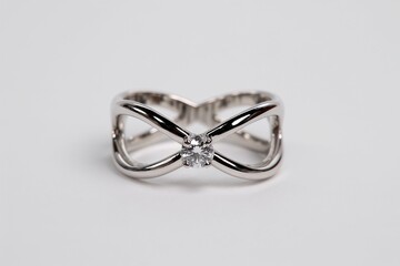 Fototapeta premium Silver infinity diamond ring on white background