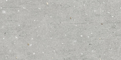 Gray concrete texture with stones for ceramic tile design. Cement background for a porcelain tile carpet.