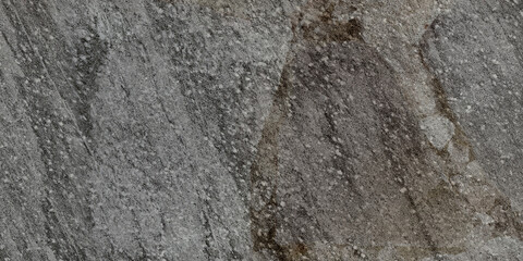 The rough surface of a stone slab with a concrete hue. Design for porcelain tiles