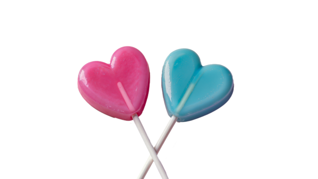 Two glossy heart lollipops: pink and blue, on a transparent background.