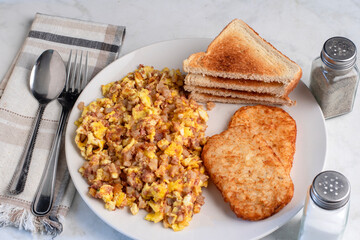 scramble eggs  and corn beef hash withhash browns