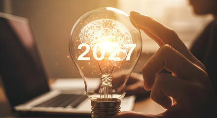Illuminated Light Bulb with Brain and Year 2027 Symbolizing Innovation and Future Ideas.