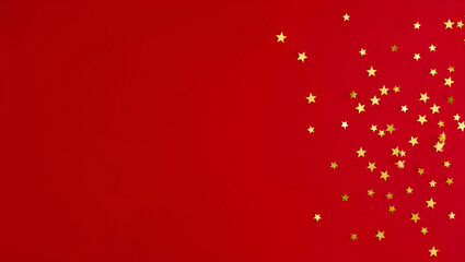 Golden stars confetti scattered across vibrant red background design