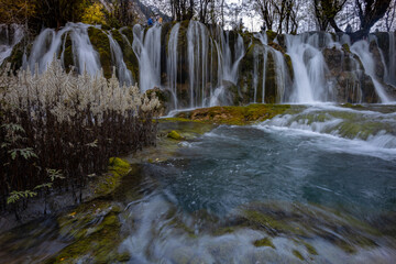 The  Arrow Bamboo Lake Waterfall in Jiuzhaigou National Park is a famous tourist attraction in Sichuan, especially during the autumn leaves season, China