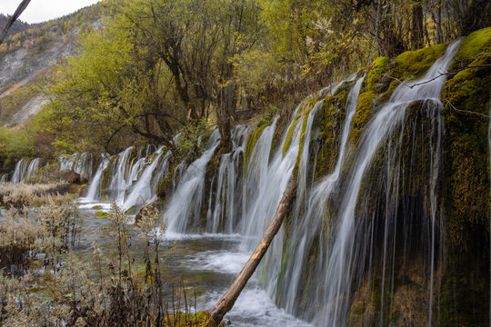 The  Arrow Bamboo Lake Waterfall in Jiuzhaigou National Park is a famous tourist attraction in Sichuan, especially during the autumn leaves season, China