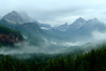 Misty Mountain Peaks Looming Above Evergreen Forest