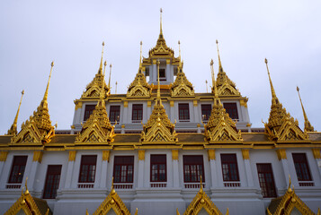 Fototapeta premium Front view of Loha Prasat Metal Palace in Wat Ratchanatdaram, Bangkok Thailand