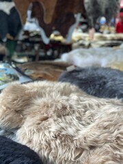 Close-Up Texture of Stacked Sheepskin Fur in Soft Neutral Colors