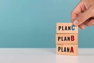 A man choose Plan C over Plan A and Plan B. Backup plan, multiple plans, strategies and option concept