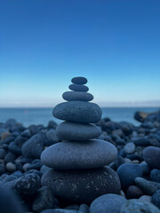 Stone cairn on a pebble beach by the Black Sea