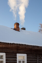 Column of smoke rises from the chimney