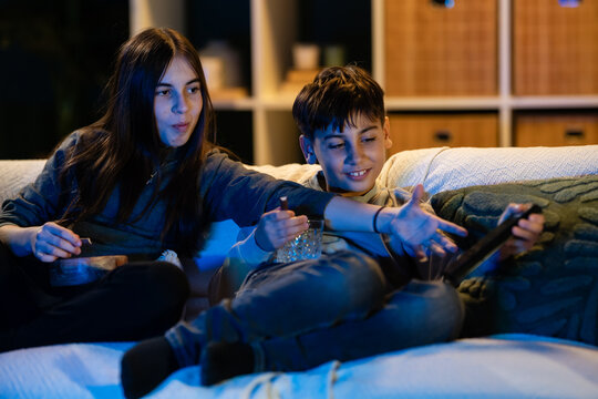 Siblings enjoying screen time together at home