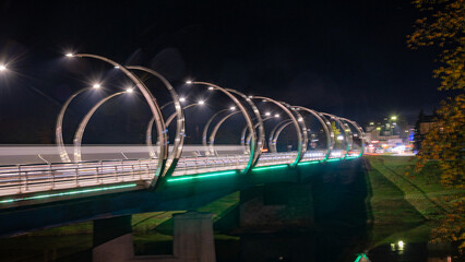 autumn landscape with colorful bridge lighting, evening twilight, beautiful, blurred light objects
