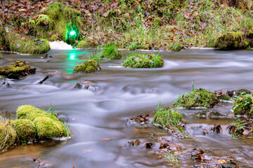 A long exposure view of water spilling over rapids, autumn landscape, November in nature, Ieriku mill, Latvia, fall