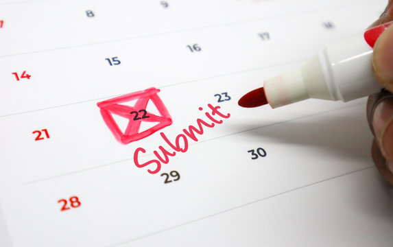A hand marking an urgent Submit deadline with a red pen and envelope icon on a calendar, emphasizing important due dates for tasks and projects