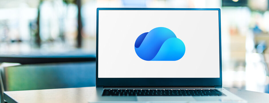 Laptop computer displaying logo of Microsoft OneDrive