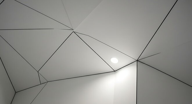 Geometric ceiling design with a network of interconnected triangular shapes and a central light source.