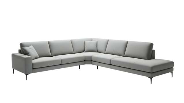 A modern, light grey sectional sofa with cushions, set against a black background