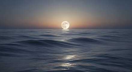 Full moon rising over dark ocean water
