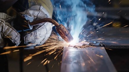 Welding process close up: metalwork and fabrication sparks in slow motion industrial - Powered by Adobe