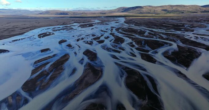 A stunning aerial view of Skei&eth;ar&aacute;rsandur reveals a complex network of meltwater channels, where glacial energy sculpts intricate and ever-changing patterns across Iceland&rsquo;s vast sandur plains.