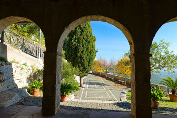The arches of a medieval church overlooking the town street in Rocca d'Arce, Italy.