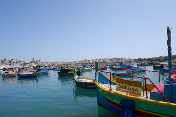Fototapeta premium Colorful Fishing Boats in Marsaxlokk Harbor, Malta