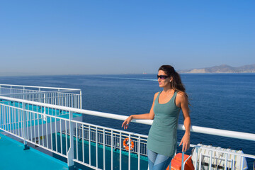 Female Passenger Leaning on the Rail During Boat Ride
