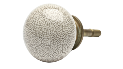 Close-up of a decorative porcelain door knob with a crackle glaze and brass fitting