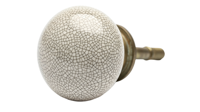 Close-up of a decorative porcelain door knob with a crackle glaze and brass fitting