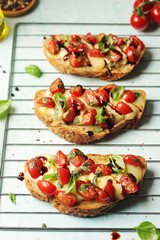 Freshly made bruschetta sandwiches - traditional dish of Italian cuisine	