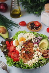 A bowl with cobb salad, traditional American dish