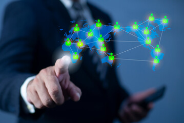 Businessman hand pointing global network connection world map people icons and line composition concept of global business.