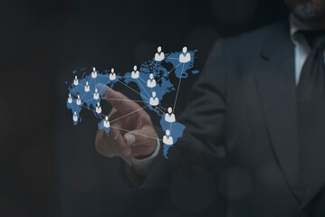 Businessman hand pointing global network connection world map people icons and line composition concept of global business.