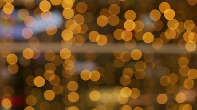 Golden and red warm bokeh lights on a dark background softly blurred circles of light festive cozy atmosphere