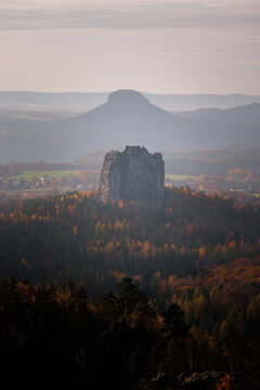 Falkenstein during sunset golden hour autumn forest fall Lilienstein in the background