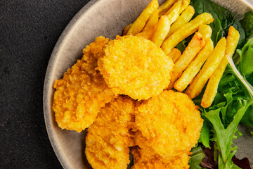 Nuggets and french fries fast food tasty snack fresh delicious gourmet food fonna on the table...